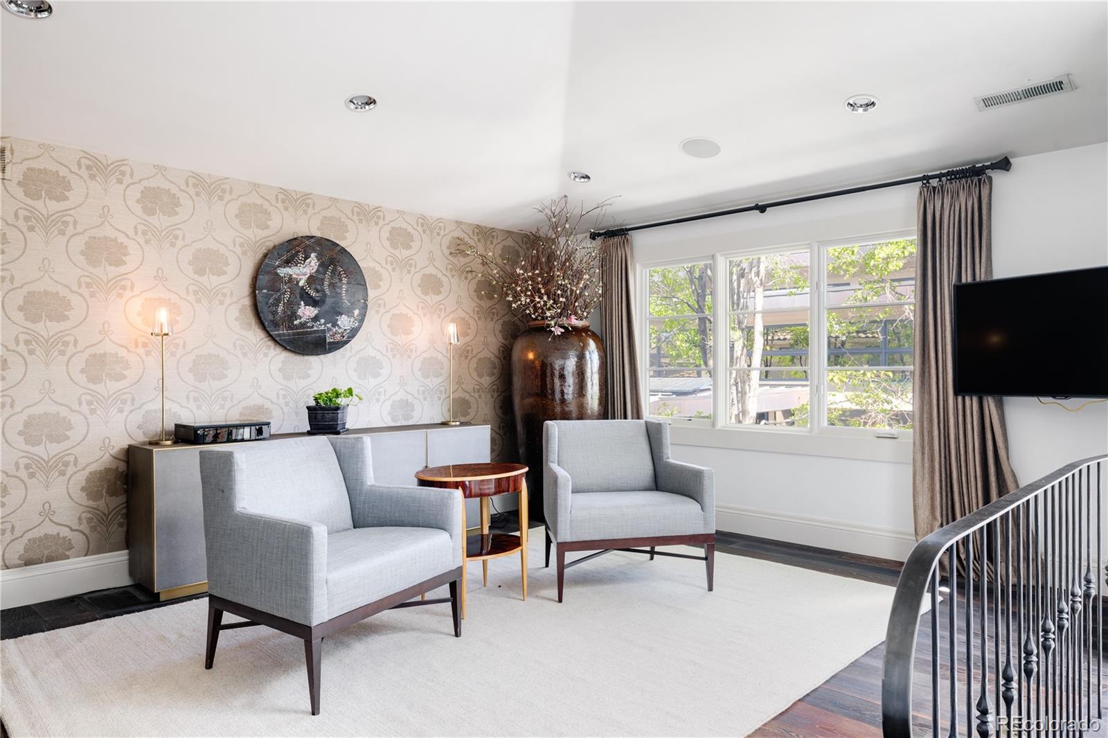 469 Cook Street Denver, CO 80206 - Photo 27 of 50 a living room with furniture and a large window