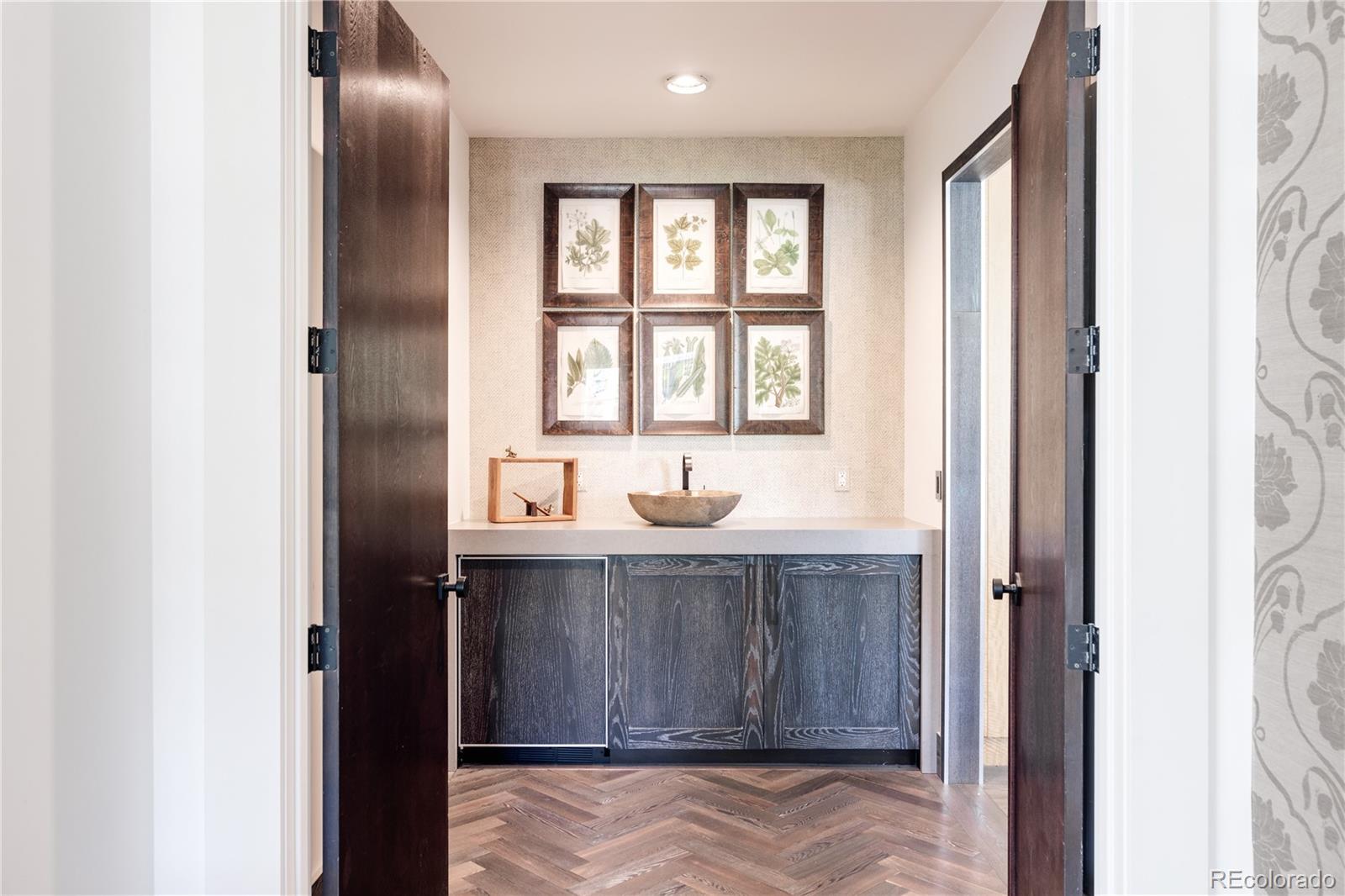 469 Cook Street Denver, CO 80206 - Photo 30 of 50 a bathroom with a sink and a mirror