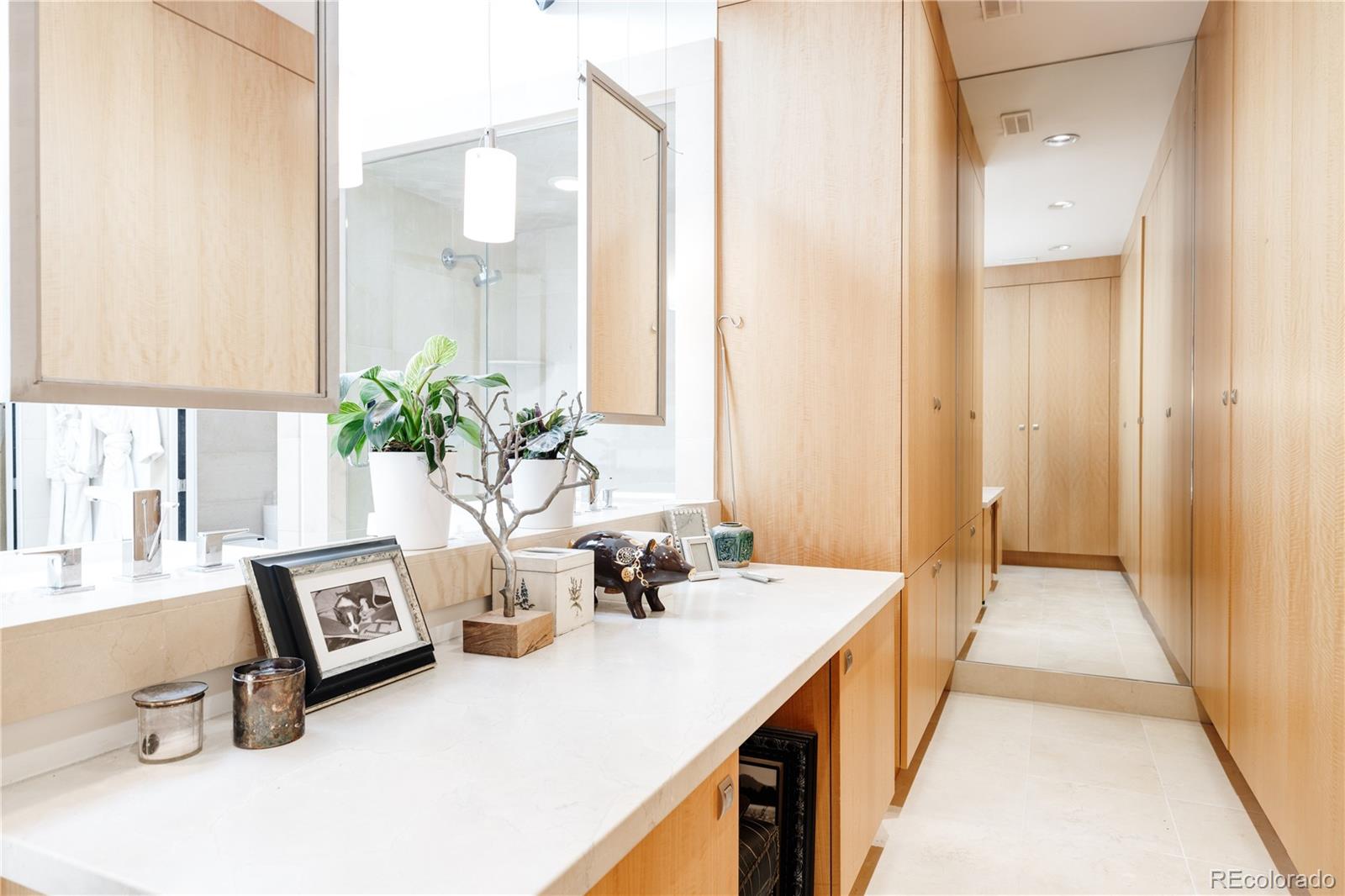 469 Cook Street Denver, CO 80206 - Photo 35 of 50 a hall with a sink and a mirror