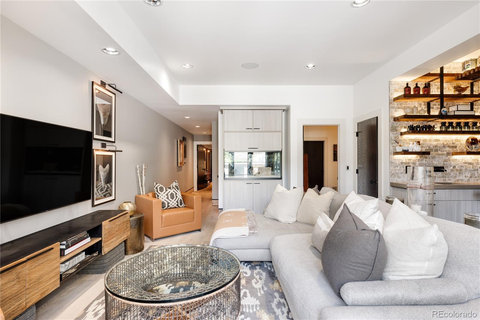 469 Cook Street Denver, CO 80206 - Photo 41 of 50 a living room with furniture and a flat screen tv
