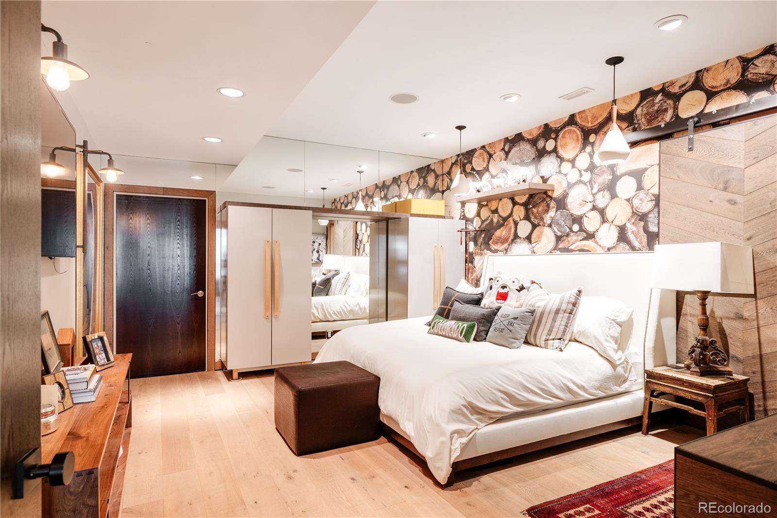 469 Cook Street Denver, CO 80206 - Photo 45 of 50 a bedroom with a bed and a walk in closet