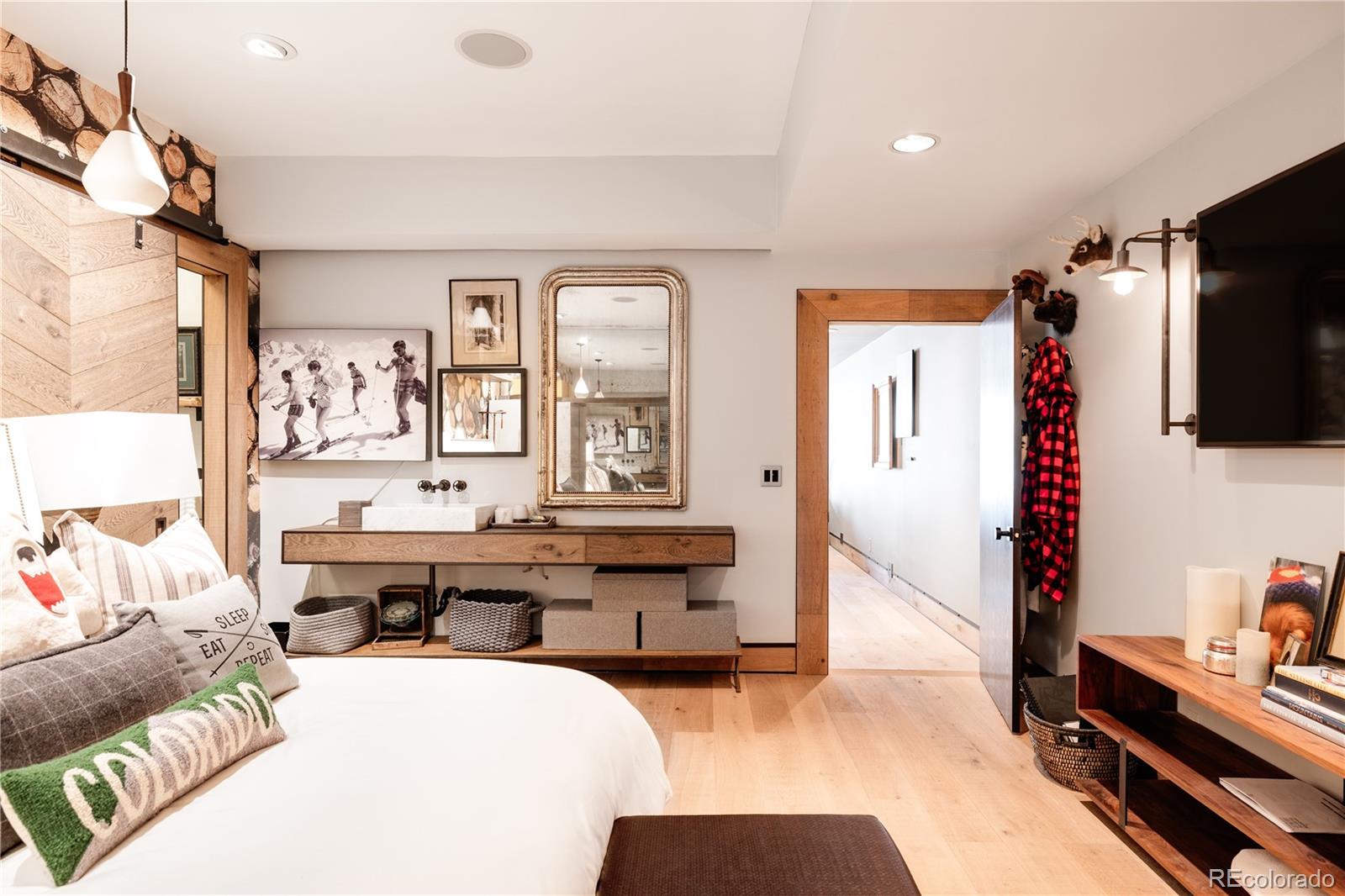 469 Cook Street Denver, CO 80206 - Photo 47 of 50 a living room with furniture and a flat screen tv