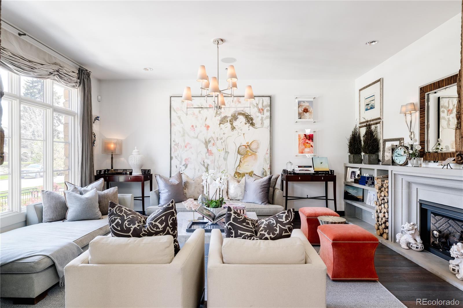 469 Cook Street Denver, CO 80206 - Photo 5 of 50 a living room with furniture a fireplace and a chandelier