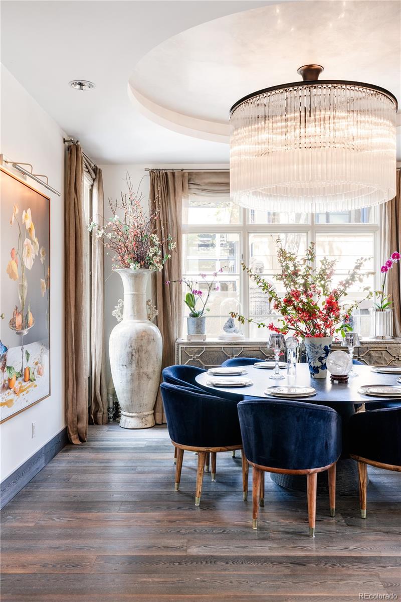 469 Cook Street Denver, CO 80206 - Photo 9 of 50 a view of a dining room with furniture window and wooden floor