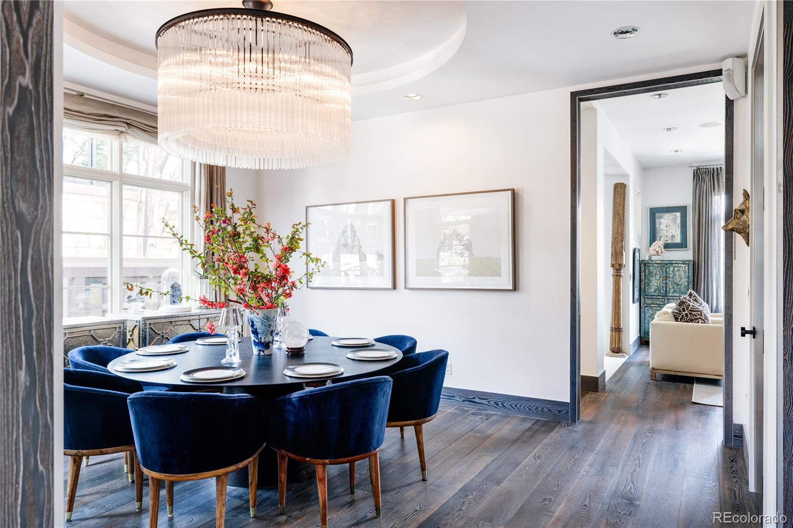 469 Cook Street Denver, CO 80206 - Photo 10 of 50 a dining room with furniture a chandelier and wooden floor