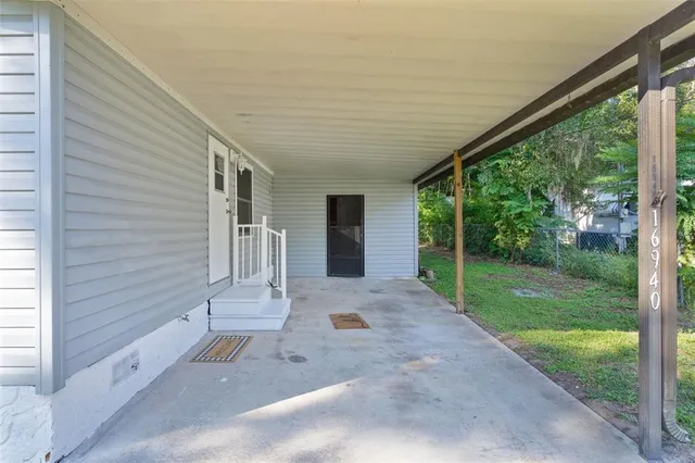 a view of a back yard from a porch