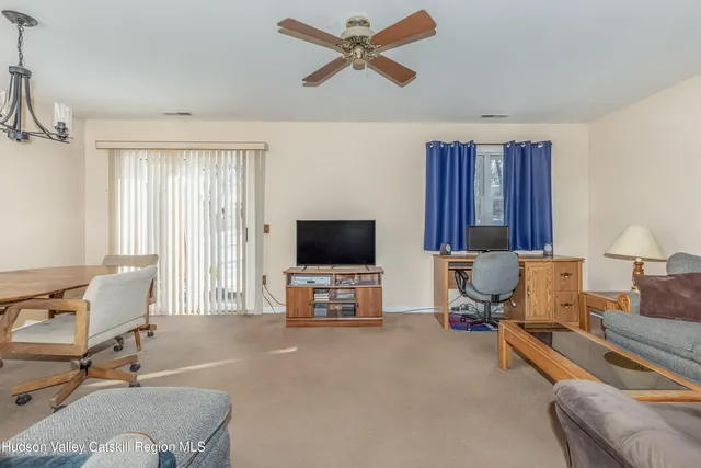 a view of livingroom and dining room with furniture