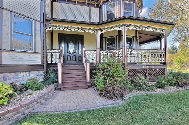 11906 Burr Street Crown Point, IN 46307 - Photo 3 of 10 a front view of a house with garden