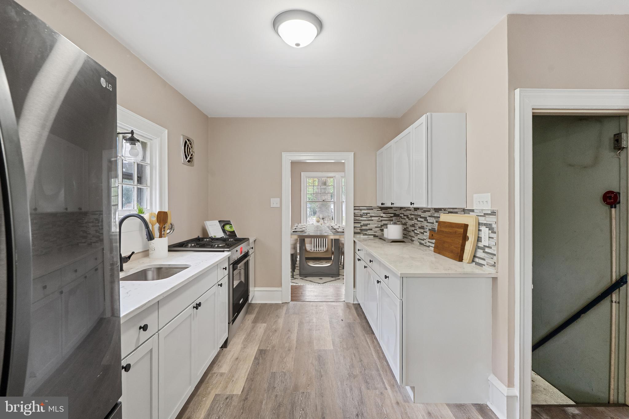 414 Main Street Dorchester, NJ 08316 - Photo 6 of 22 a kitchen with a sink stove and refrigerator