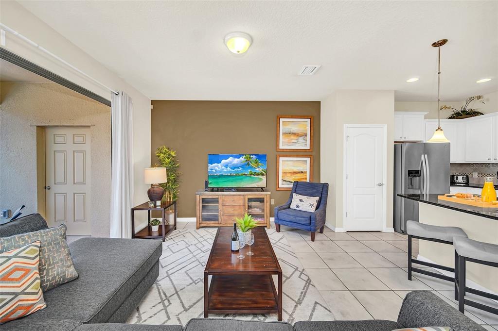 2070 Rome Drive Kissimmee, FL 34747 - Photo 17 of 57 a living room with furniture and a flat screen tv