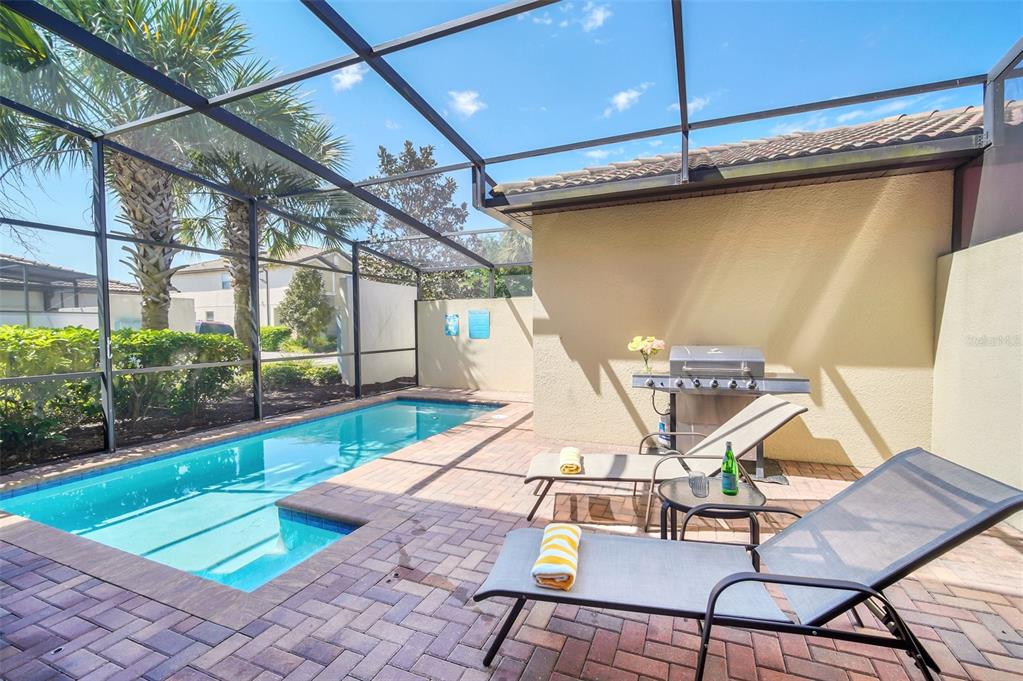 2070 Rome Drive Kissimmee, FL 34747 - Photo 2 of 57 a view of a patio with a table and chairs