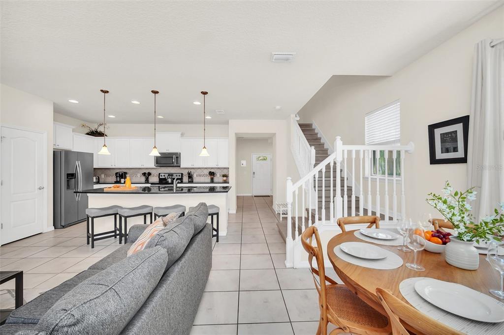 2070 Rome Drive Kissimmee, FL 34747 - Photo 24 of 57 a living room with stainless steel appliances kitchen island granite countertop furniture and a kitchen view
