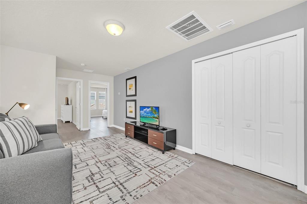 2070 Rome Drive Kissimmee, FL 34747 - Photo 27 of 57 a bedroom with furniture and a window