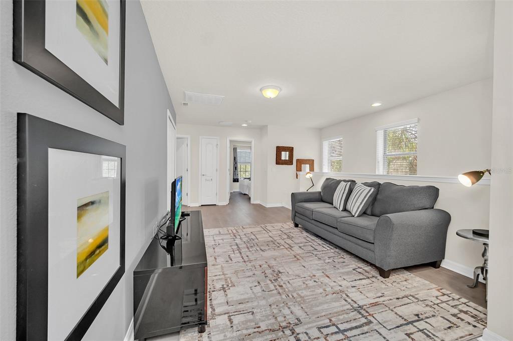 2070 Rome Drive Kissimmee, FL 34747 - Photo 28 of 57 a living room with furniture and painting on the wall