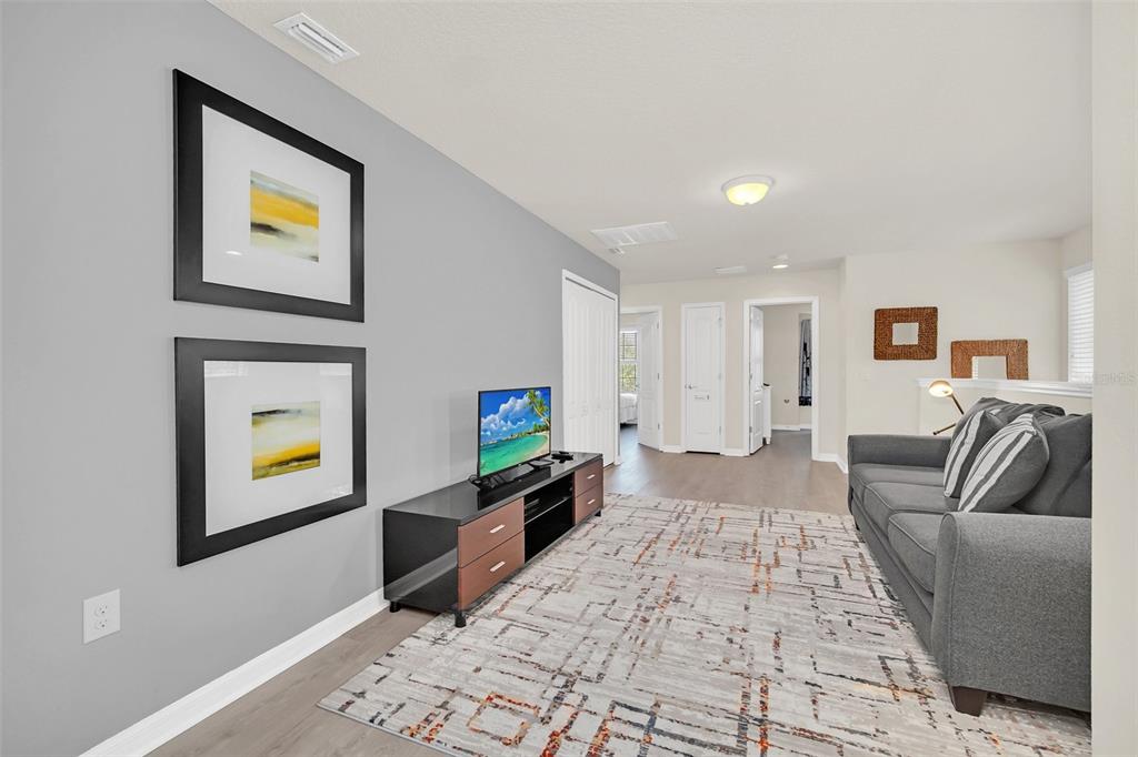 2070 Rome Drive Kissimmee, FL 34747 - Photo 29 of 57 a living room with furniture and a rug