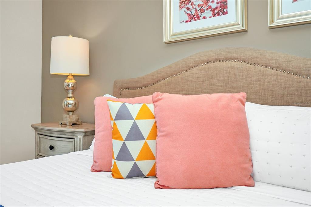 2070 Rome Drive Kissimmee, FL 34747 - Photo 31 of 57 a bedroom with a bed and a lamp on dresser