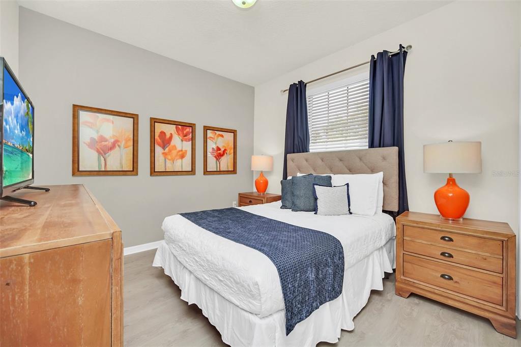 2070 Rome Drive Kissimmee, FL 34747 - Photo 35 of 57 a bedroom with a bed and a flat screen tv