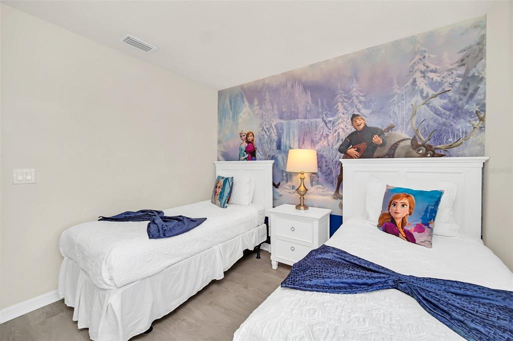 2070 Rome Drive Kissimmee, FL 34747 - Photo 4 of 57 a bedroom with bed and wall painting