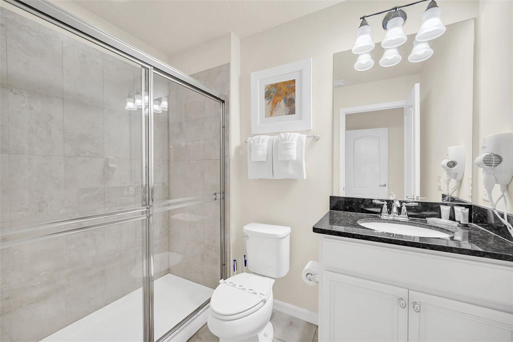 2070 Rome Drive Kissimmee, FL 34747 - Photo 41 of 57 a bathroom with a toilet sink and shower