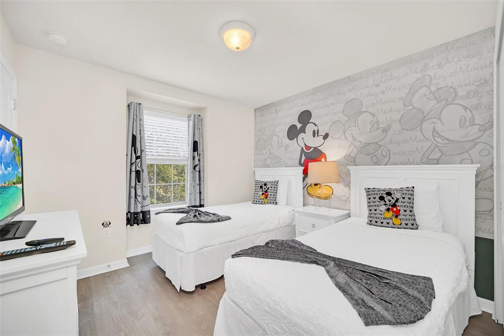 2070 Rome Drive Kissimmee, FL 34747 - Photo 42 of 57 a bedroom with a bed and a window