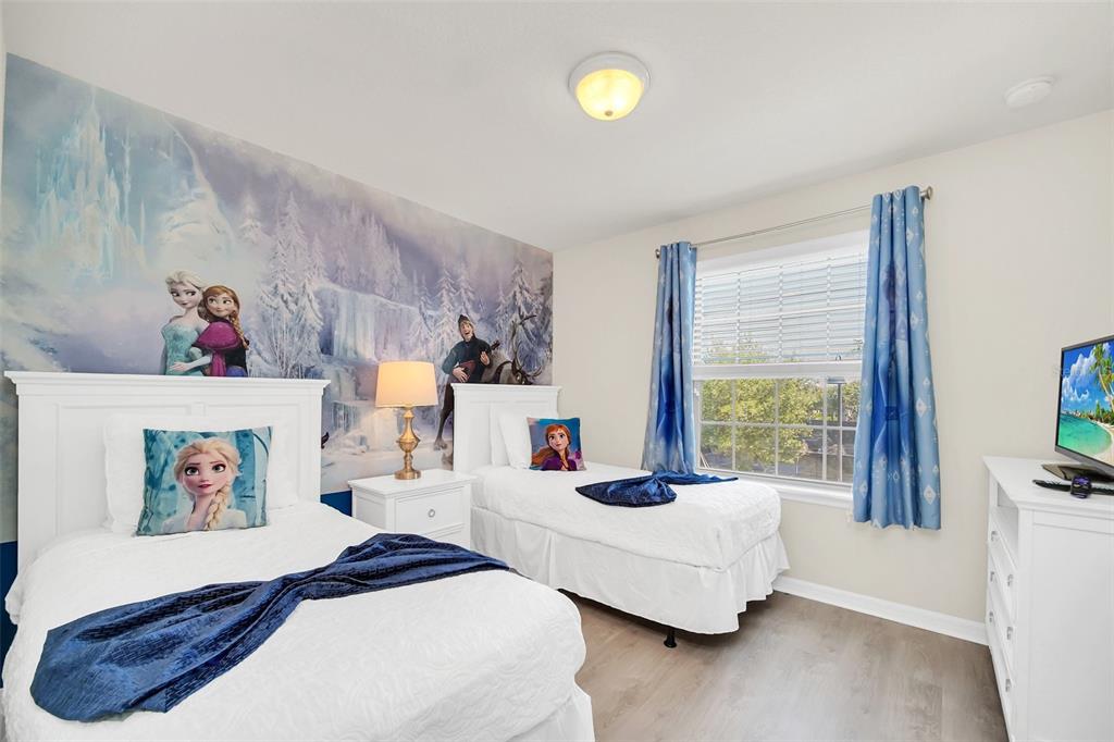 2070 Rome Drive Kissimmee, FL 34747 - Photo 45 of 57 a bedroom with furniture and a large window