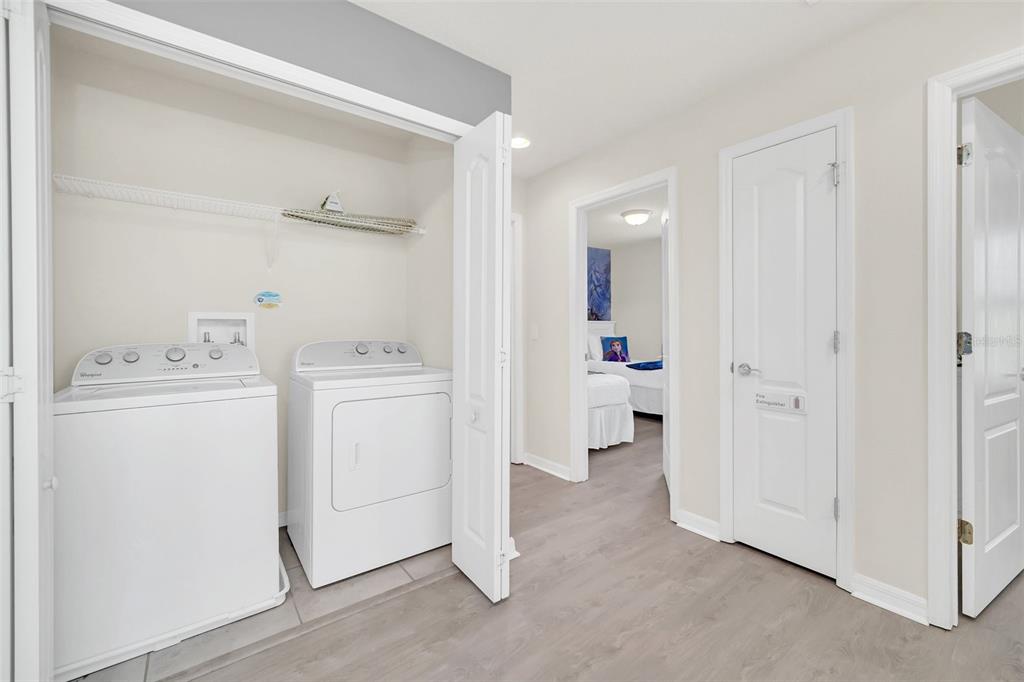 2070 Rome Drive Kissimmee, FL 34747 - Photo 48 of 57 a view of utility room with washer and dryer