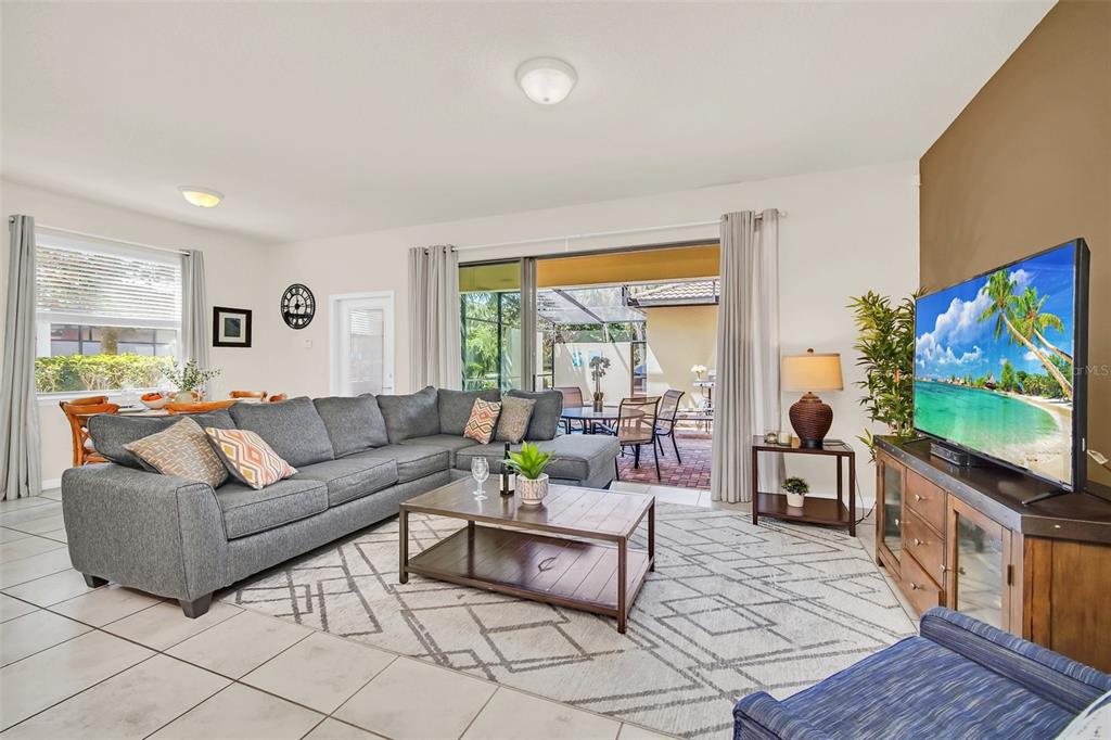 2070 Rome Drive Kissimmee, FL 34747 - Photo 5 of 57 a living room with furniture and a flat screen tv