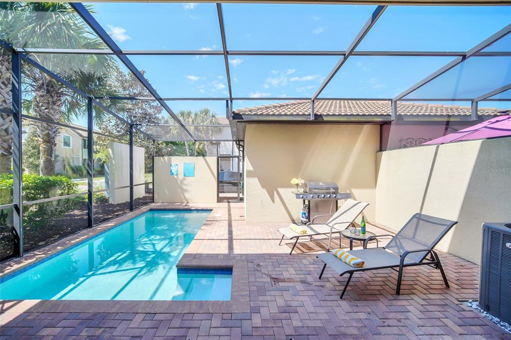 2070 Rome Drive Kissimmee, FL 34747 - Photo 51 of 57 a view of a patio with table and chairs with wooden floor