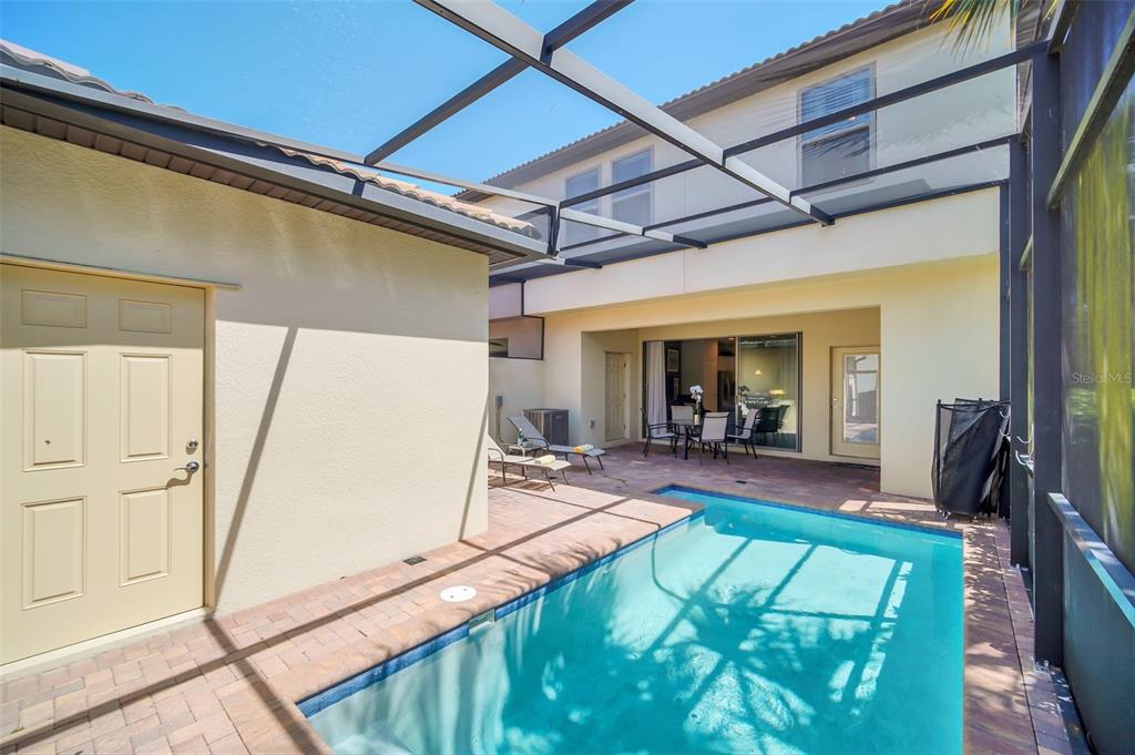 2070 Rome Drive Kissimmee, FL 34747 - Photo 55 of 57 a view of a porch with furniture and floor to ceiling window