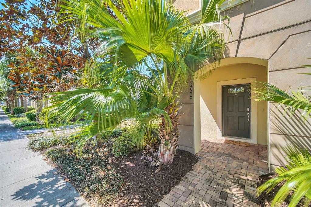 2070 Rome Drive Kissimmee, FL 34747 - Photo 6 of 57 a front view of a house with a yard