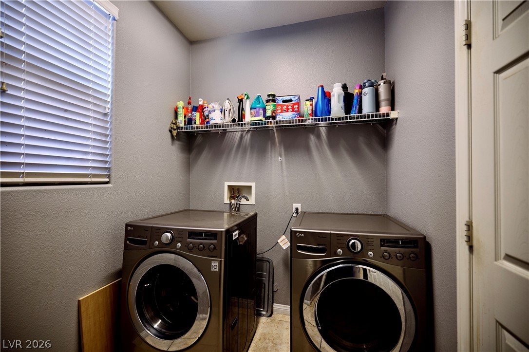 193 Tuscan Shadow Street Henderson, NV 89012 - Photo 14 of 27 This dedicated utility room offers convenient in-home laundry solutions.