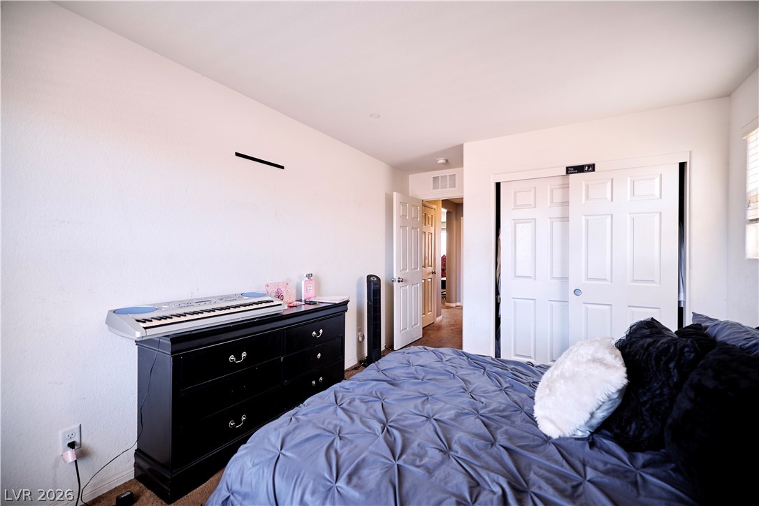 193 Tuscan Shadow Street Henderson, NV 89012 - Photo 27 of 27 This bedroom offers comfortable living with ample storage options.