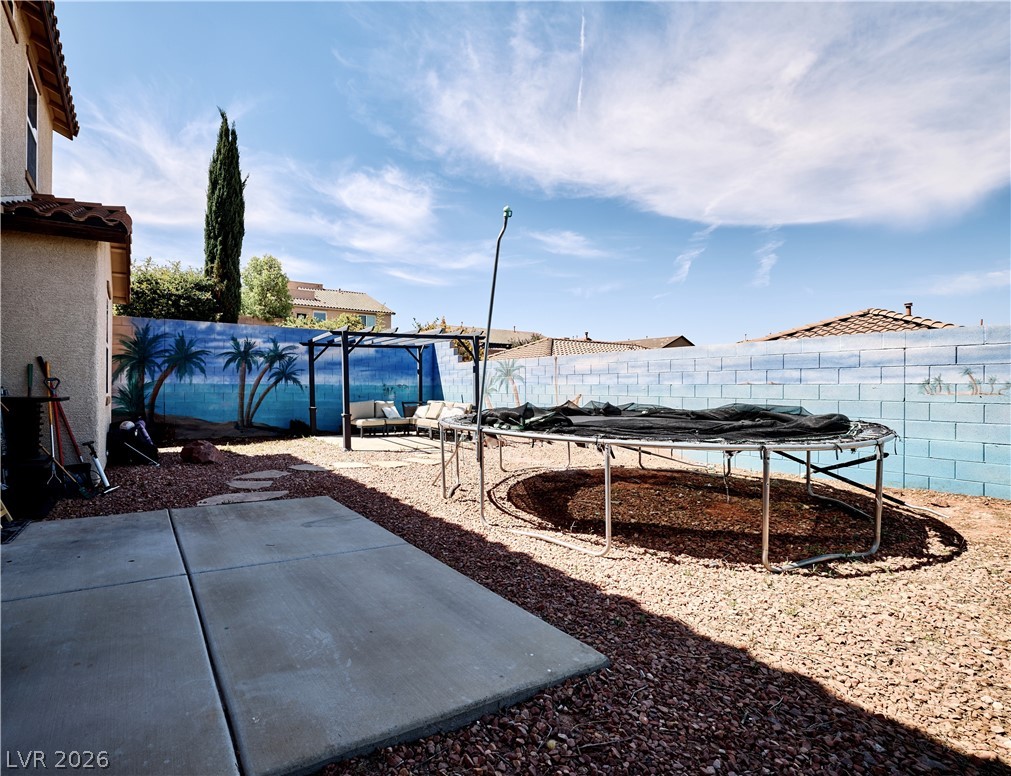 193 Tuscan Shadow Street Henderson, NV 89012 - Photo 4 of 27 This yard features a pergola for relaxation.
