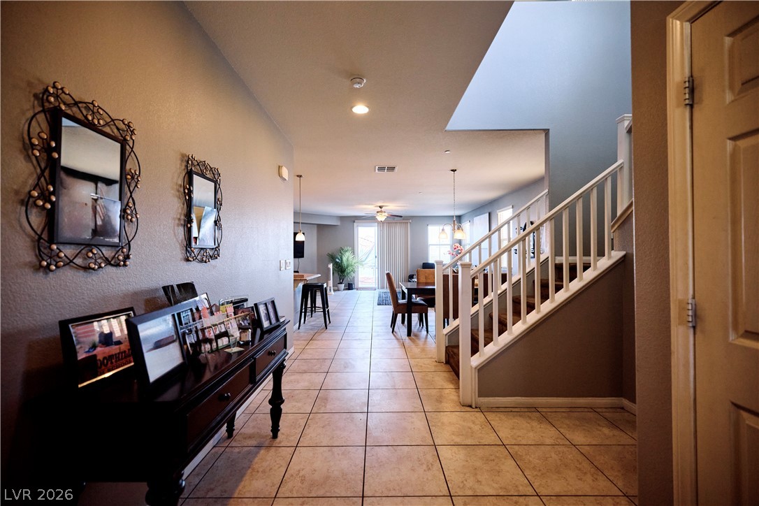 193 Tuscan Shadow Street Henderson, NV 89012 - Photo 5 of 27 This inviting interior features a staircase and open living spaces, perfect for seamless everyday living.