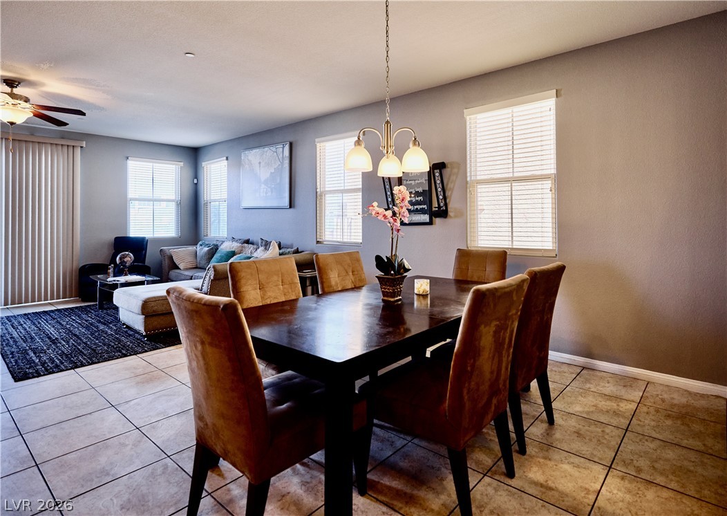 193 Tuscan Shadow Street Henderson, NV 89012 - Photo 7 of 27 This inviting dining area features a warm ambiance, perfect for gatherings and everyday meals.