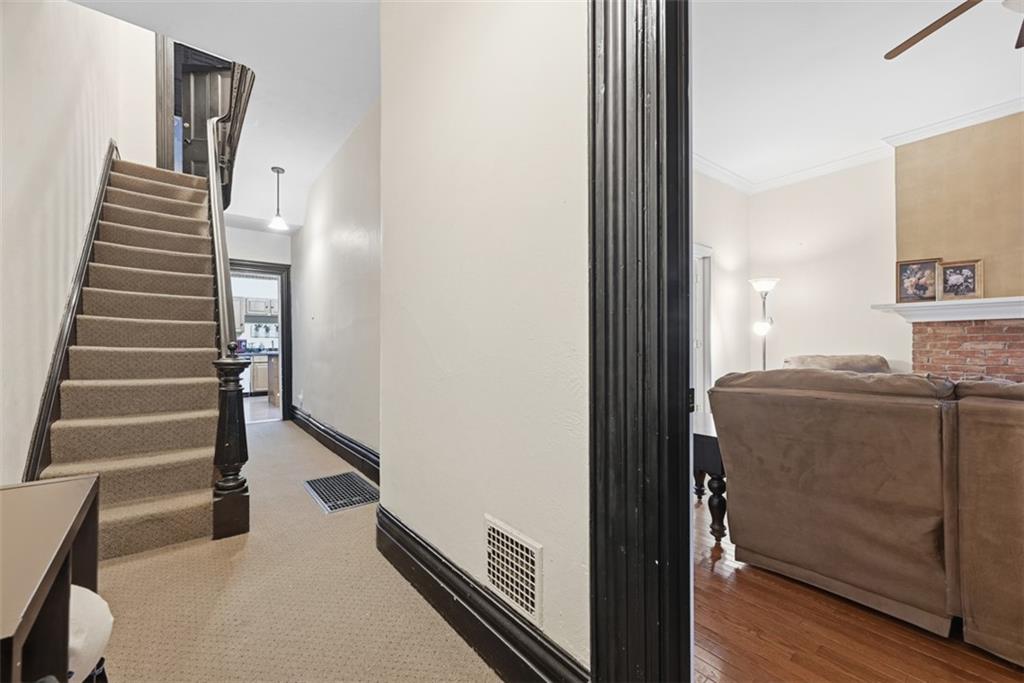 110 South 13th Street Pittsburgh, PA 15203 - Photo 15 of 36 a view of a hallway with wooden floor and staircase