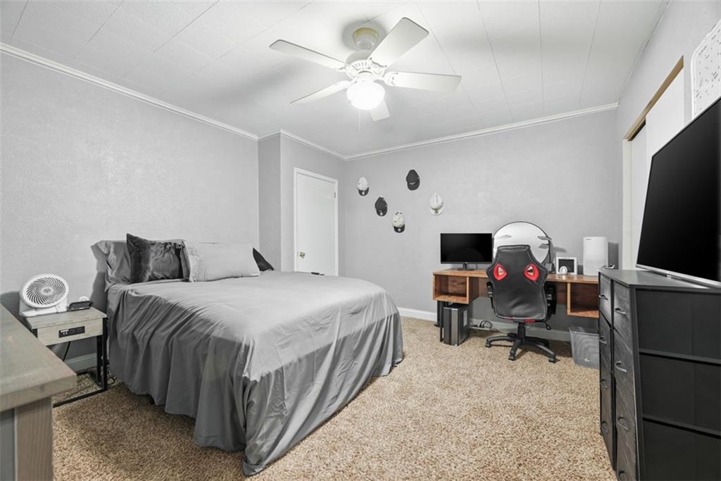 110 South 13th Street Pittsburgh, PA 15203 - Photo 20 of 36 a bedroom with a bed desk and a window