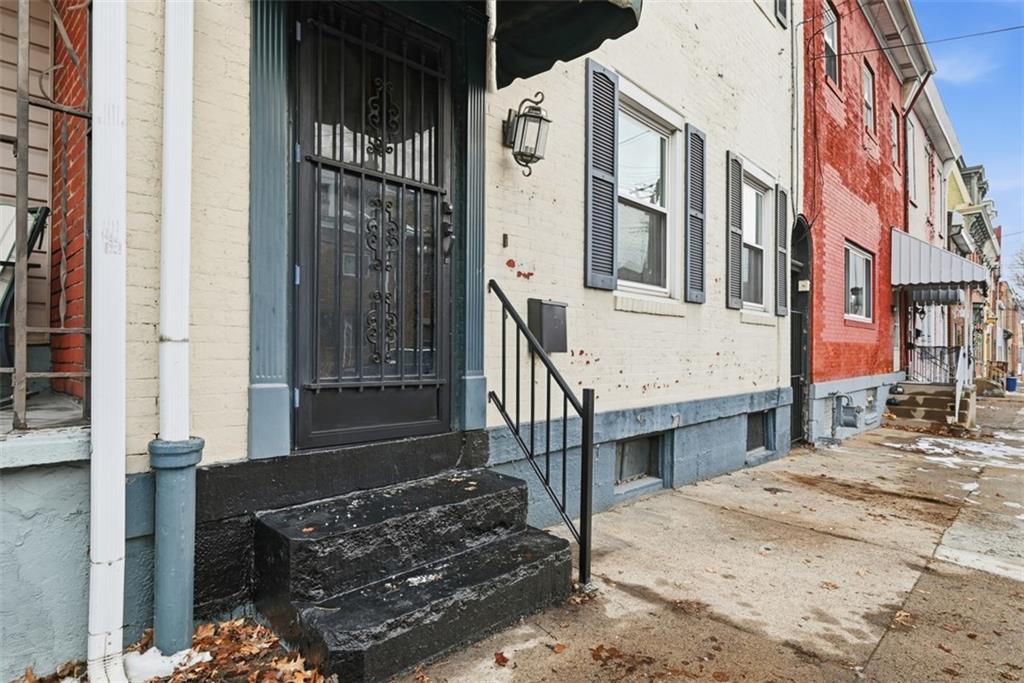 110 South 13th Street Pittsburgh, PA 15203 - Photo 2 of 36 a view of residential house with wooden fence
