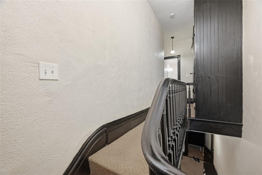 110 South 13th Street Pittsburgh, PA 15203 - Photo 21 of 36 a view of staircase with wooden walls and railing