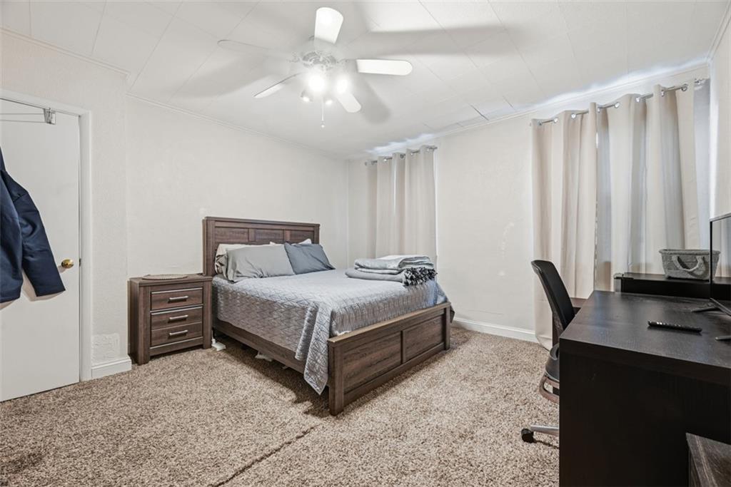 110 South 13th Street Pittsburgh, PA 15203 - Photo 22 of 36 a bedroom with a bed a desk and chair