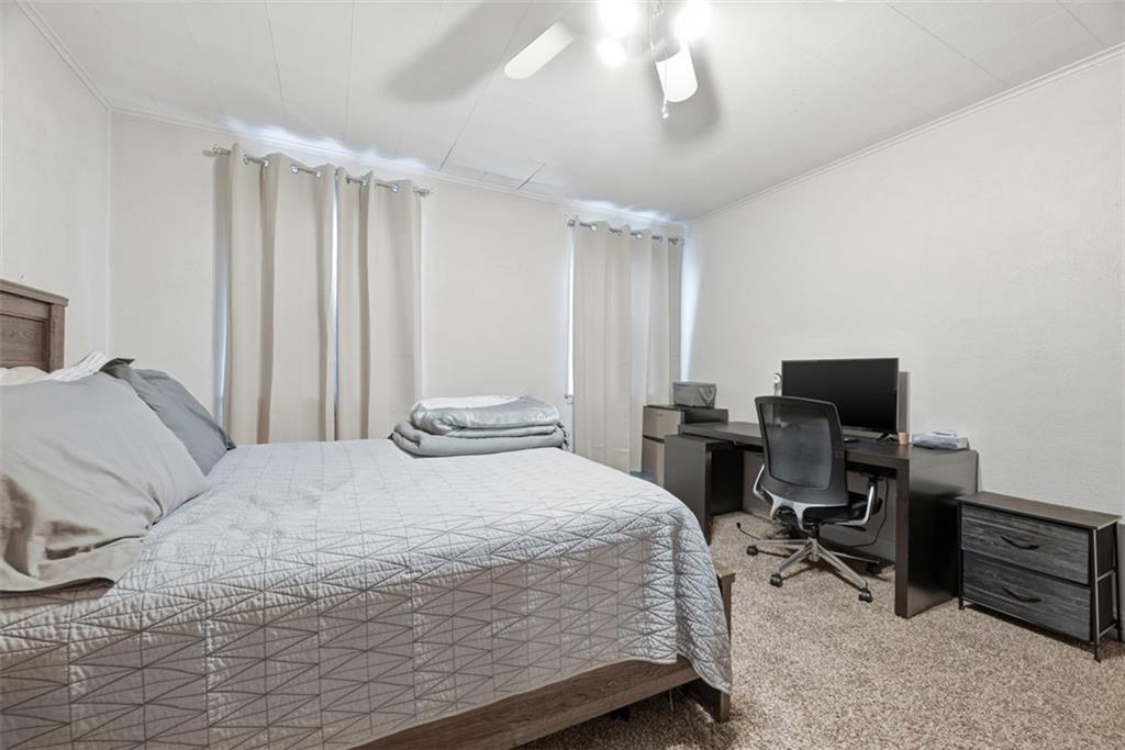 110 South 13th Street Pittsburgh, PA 15203 - Photo 23 of 36 a bedroom with a bed and a computer on the desk