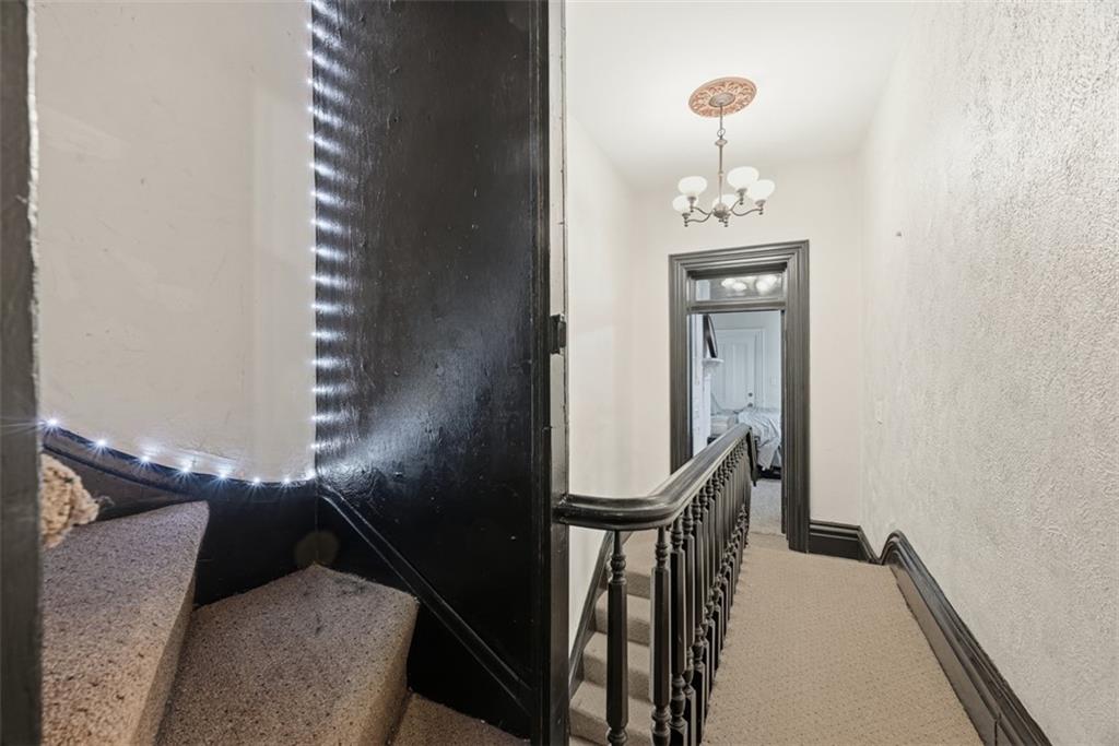 110 South 13th Street Pittsburgh, PA 15203 - Photo 25 of 36 a view of a hallway with entryway wooden floor and front door