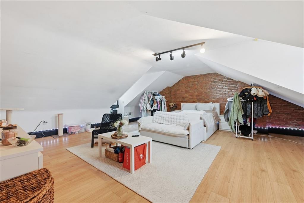 110 South 13th Street Pittsburgh, PA 15203 - Photo 26 of 36 a bedroom with furniture and a wooden floor