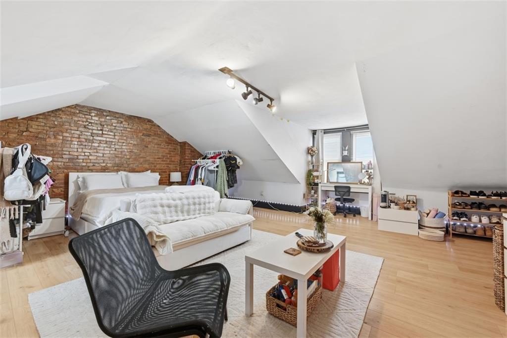 110 South 13th Street Pittsburgh, PA 15203 - Photo 27 of 36 a living room with furniture and wooden floor