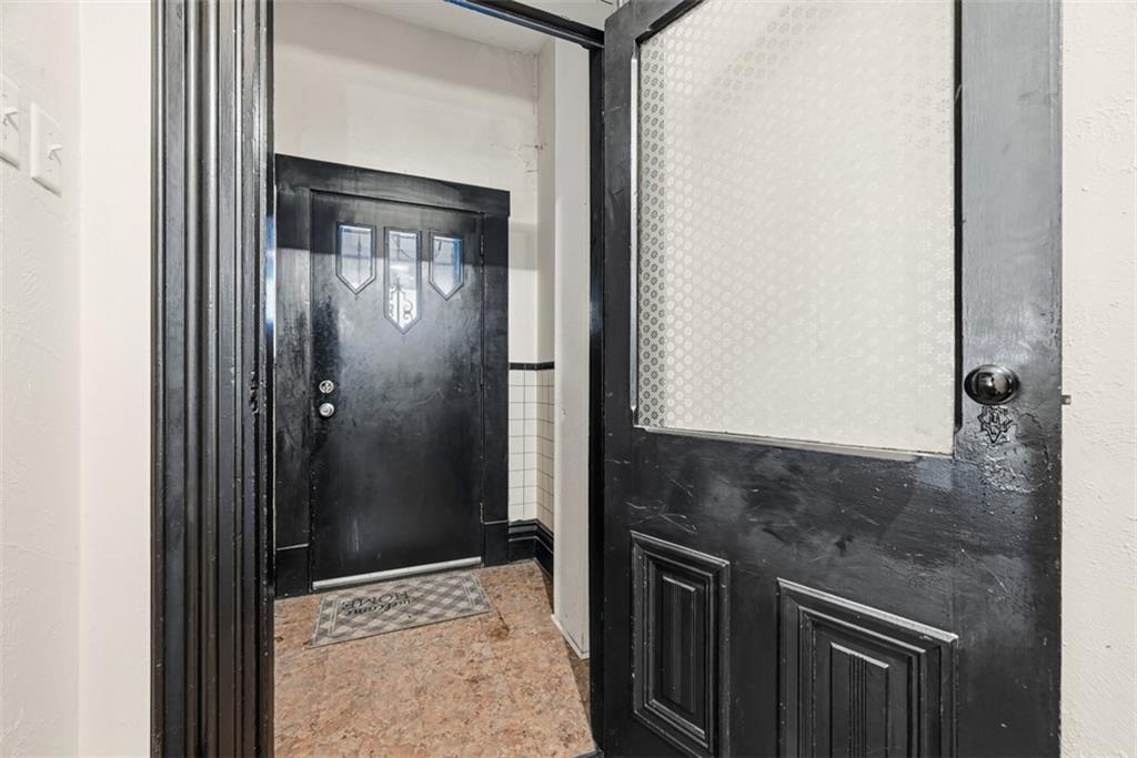 110 South 13th Street Pittsburgh, PA 15203 - Photo 3 of 36 a bathroom with a granite countertop sink a mirror and shower