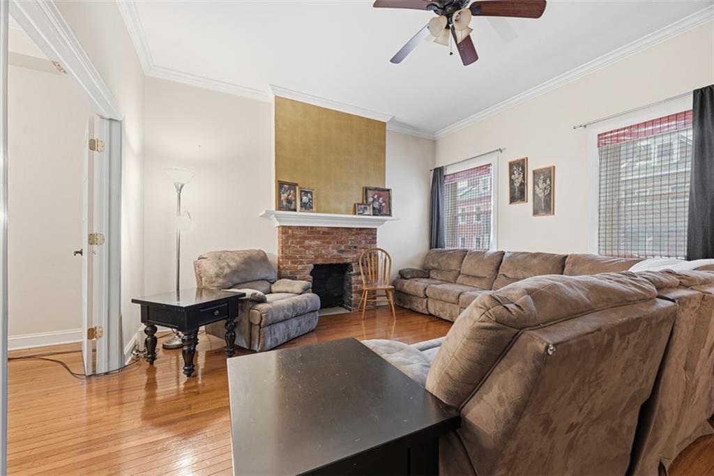 110 South 13th Street Pittsburgh, PA 15203 - Photo 4 of 36 a living room with furniture and a fireplace