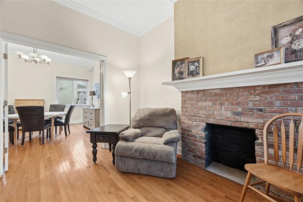 110 South 13th Street Pittsburgh, PA 15203 - Photo 6 of 36 a living room with furniture and a fireplace