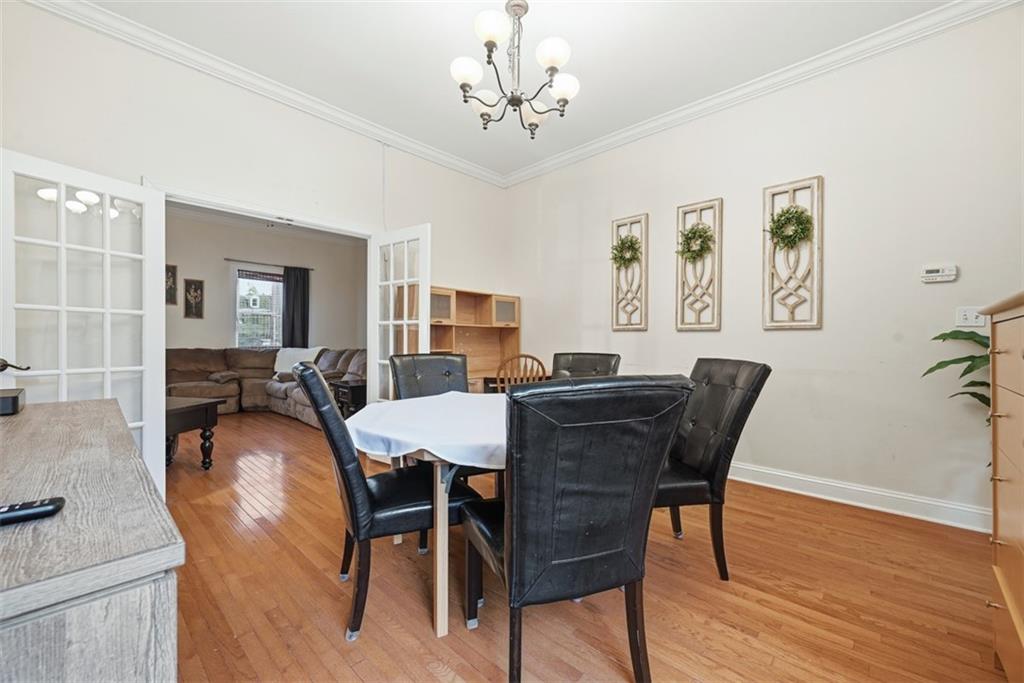 110 South 13th Street Pittsburgh, PA 15203 - Photo 9 of 36 a view of a dining room with furniture and wooden floor