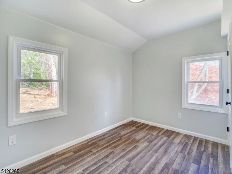 4 Emmans Road Ledgewood, NJ 07852 - Photo 11 of 25 an empty room with wooden floor and windows
