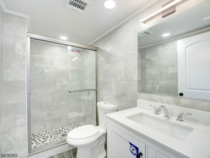 4 Emmans Road Ledgewood, NJ 07852 - Photo 12 of 25 a bathroom with a sink a toilet and shower